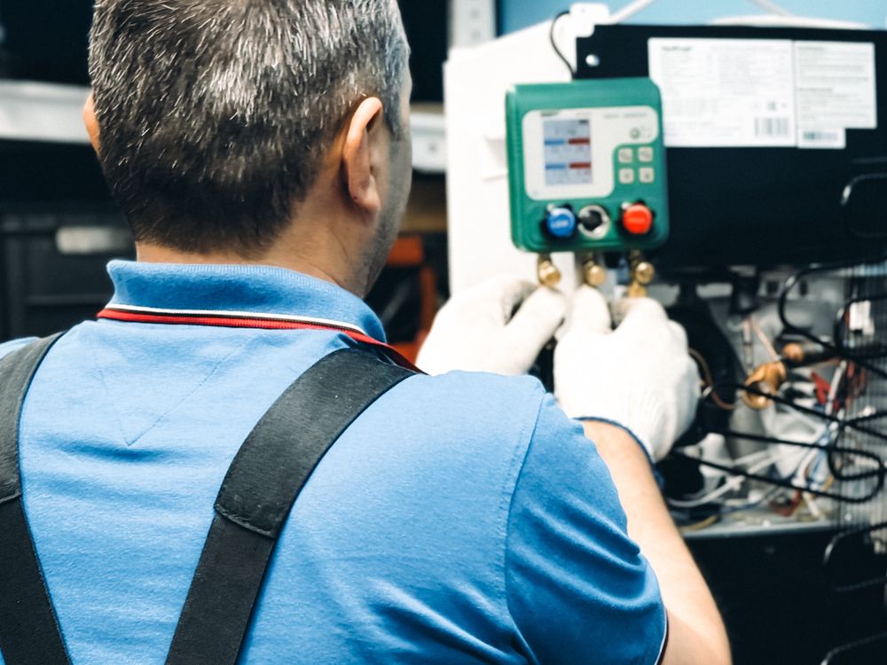 Certified Sarasota Cooling technician servicing HVAC equipment